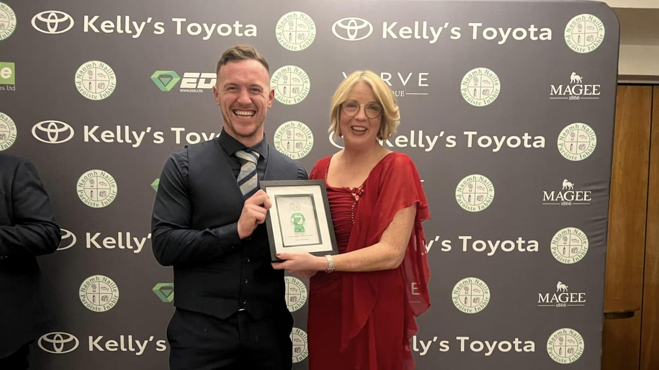 Mary Coughlan pictured presenting the 2023 Senior Player of the Year to Gavin Mulreany of St. Naul's.
